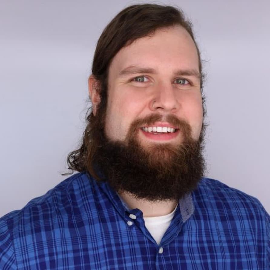 Picture of Michael Clay smiling with a white background