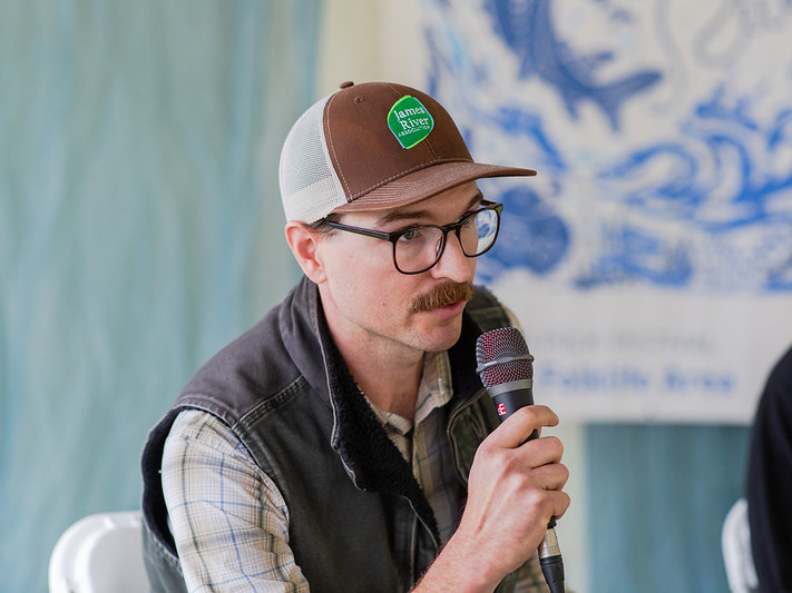 Thomas Dunlap speaks into a microphone