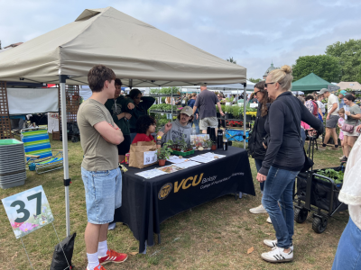 Students talking with people about plants.